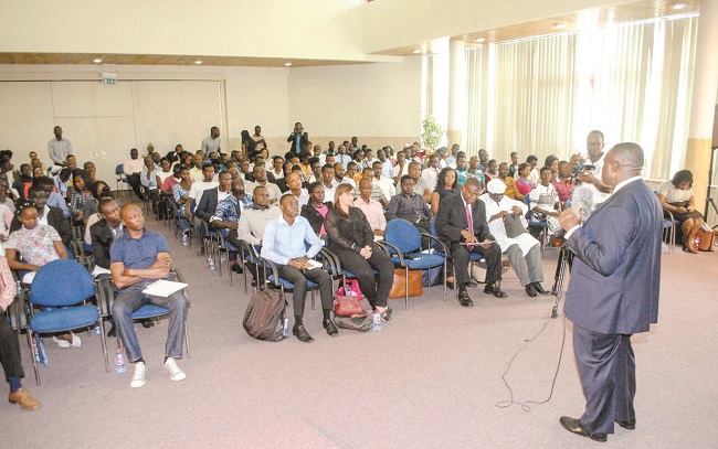 Mr Joe Mensah (standing) addressing participants
